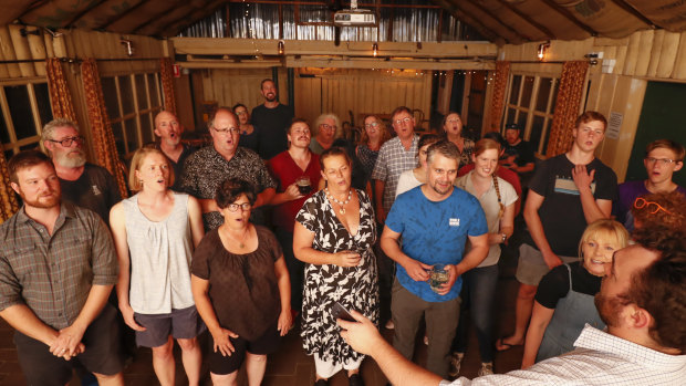 Ewan Lawrie, bottom right, leads the Canberra Shanty Club at the Old Canberra Inn.