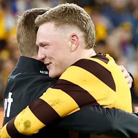 Mitchell and skipper James Sicily embrace after the Hawks’ elimination final win.