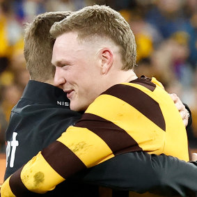 Mitchell and skipper James Sicily embrace after the Hawks’ elimination final win.