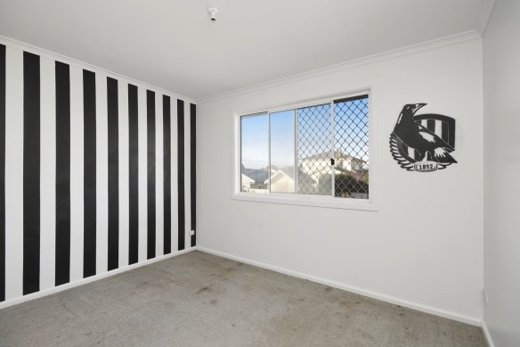 A bedroom fit for a Collingwood fan.