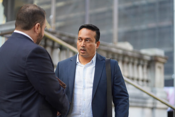 Syed Yusuf (right) outside Downing Centre Local Court on Tuesday. He is one of four people charged by ASIC with market manipulation.