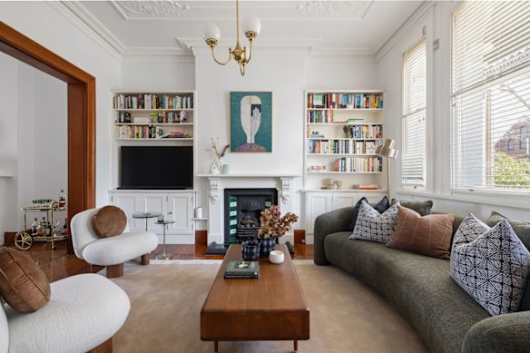 The house retains many of its original features, such as patterned ceilings, but has also been renovated for contemporary living.