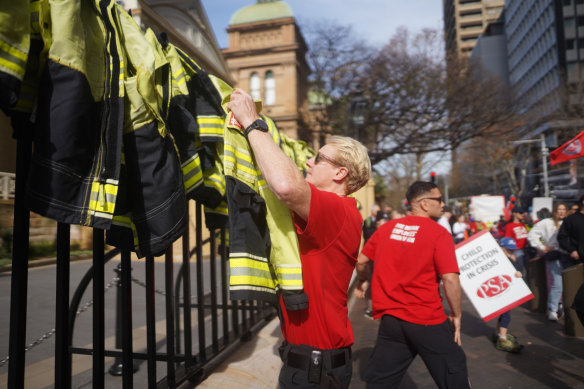 Fire and Rescue NSW workers protest outside state parliament on Thursday.