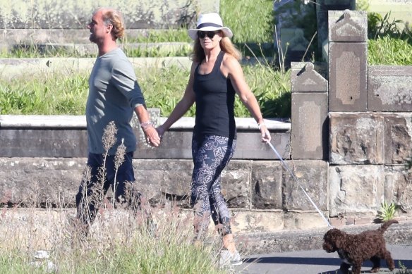 Deborah Hutton and Bondi meditation guru Andrew Marsh out walking.