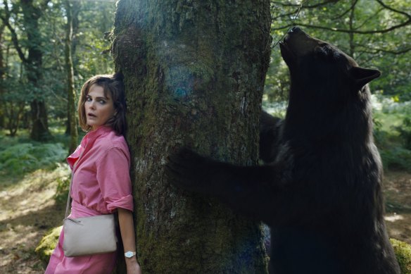 Keri Russell and one very high bear in Cocaine Bear.