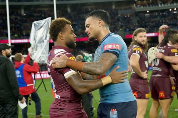 Spencer Leniu and Ezra Mam embrace after Wednesday’s Origin match in Perth.