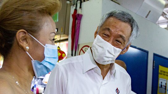 Singapore Prime Minister Lee Hsien Loong on the hustings ahead of Friday's election. There are signs he may hang on for longer than announced.