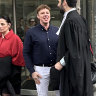 Rhett Watts (in white pants and dark shirt) was sentenced to a two year community corrections order after pleading guilty to obtaining financial advantage by deception in the County Court of Victoria