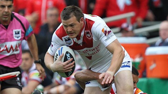 Brett Morris tries to make a break during the 2010 grand final when playing for the Dragons against the Roosters.