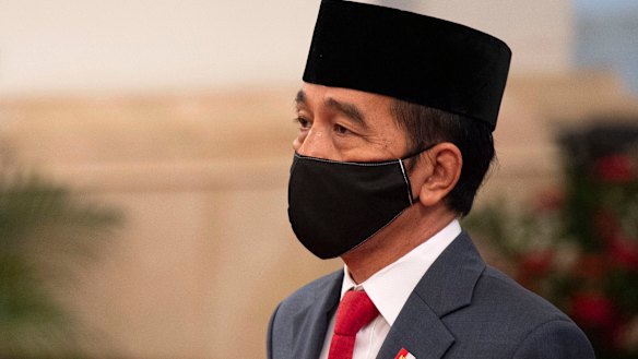 Indonesian President Joko Widodo wears a mask as a precaution against coronavirus on April 30.