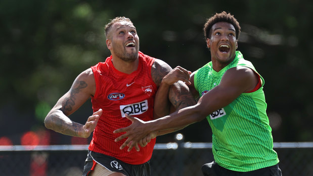 Joel Amartey competes for the ball with mentor Lance Franklin.