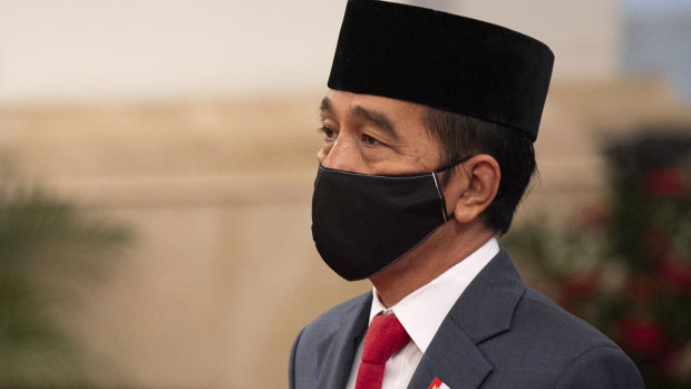 Indonesian President Joko Widodo wears a mask as a precaution against coronavirus on April 30.