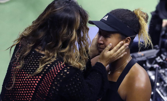 Naomi Osaka is hugged by her mom, Tamaki Osaka, after defeating Serena Williams in a controversial US Open final.