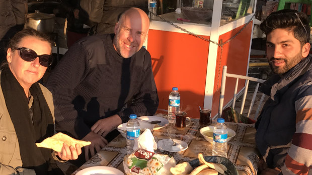 Kate Geraghty, Michael Bachelard and Halan Shekha having breakfast in what is locally known as Fish town in Northern Iraq in July 2017. 