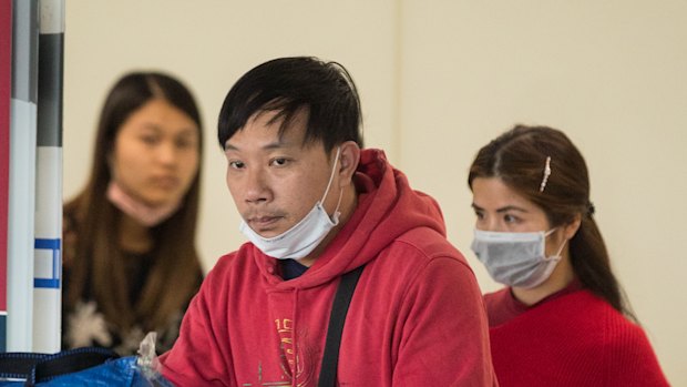 Travellers arrive at Melbourne Airport on Monday.