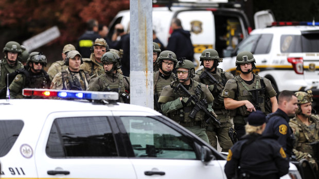Police secure the area after a man opened fire at a synagogue in Pittsburgh.
