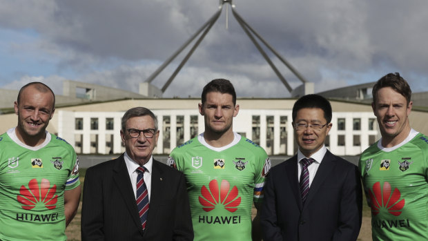 Josh Hodgson, Huawei Australia chair John Lord, Jarrod Croker, Huawei Australia CEO Hudson Liu and Sam Williams on the front lawn of Parliament House in Canberra.