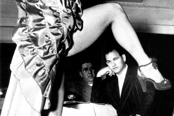 Abe Saffron watches a dancer at his Roosevelt Nightclub in Sydney in January 1951.
