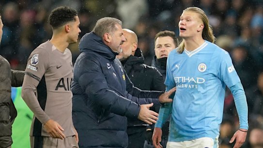 Ange Postecoglou holds back an angry Erling Haaland at the end of the match.
