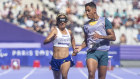 Jerusa Geber dos Santos of Brazil, right, with her guide, Gabriel Garcia, winning a 100-metre heat during the Paralympic Games at the Stade de France in Saint-Denis, France, on September 2.
