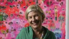 Ann Sherry at her Brisbane home with Tania Major’s painting, Poison Snake Story and the Rain of Fish, which depicts an Indigenous story from Kowanyama in Far North Queensland. The painting is one of Sherry’s favourites, and was a recent purchase.