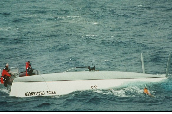 Bullimore emerges as HMAS Adelaide crew knock on the opposite side of the hull. This image was part of a folio that won the West Australian Press Photographer of the Year Awards for Tony McDonough, a Perth freelance photographer sent by Fairfax Media to cover the situation.