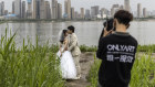 Newlyweds pose for photos in Wuhan, China.