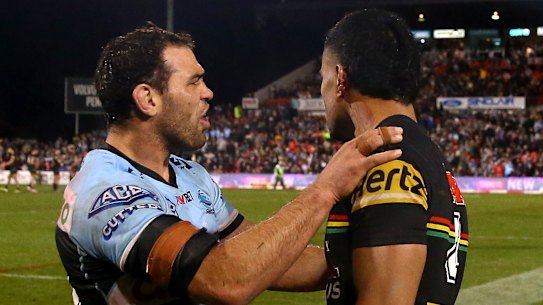 Dale Finucane looks at the ear of Stephen Crichton.