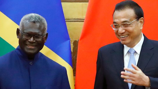 Solomon Islands Prime Minister Manasseh Sogavare with Chinese Premier Li Keqiang in Beijing in October 2019.