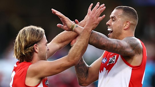 James Rowbottom and Lance Franklin celebrate the match-sealing goal in yesterday’s nine-point victory over the Saints.
