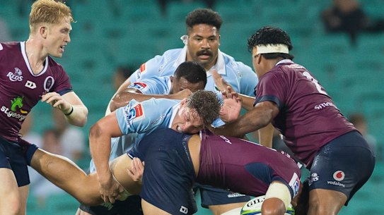 Crunch time: Lukhan Salakaia-Loto runs into some stern Waratahs defence.