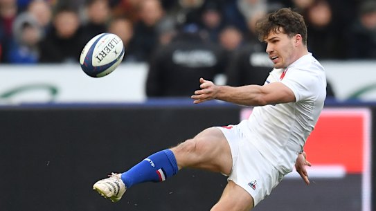 Antoine Dupont kicking for France.