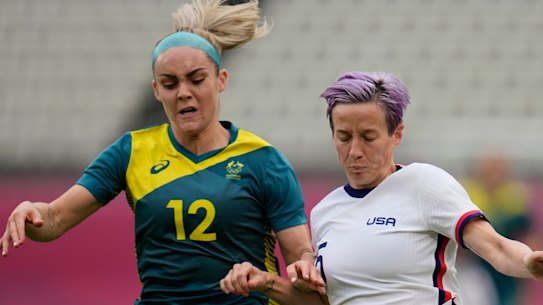 Australia’s Ellie Carpenter and USA superstar Megan Rapinoe battle for the ball at the Tokyo Olympics.