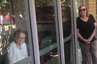 Mary Watson, right, visited her mother, Alice Bacon, at Newmarch House through the window for her birthday on April 5.