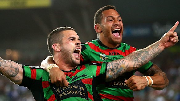 Adam Reynolds and Api Koroisau celebrate South Sydney's 2014 grand final win against the Bulldogs.