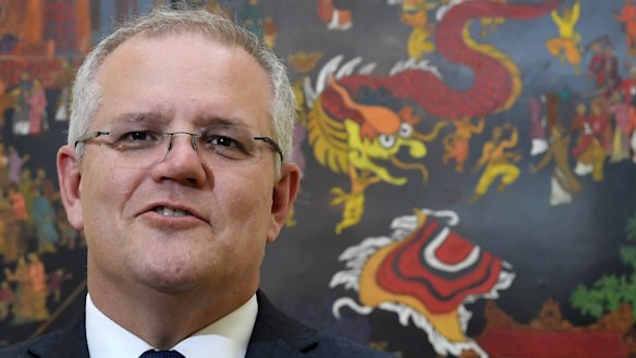 Australian Prime Minister Scott Morrison speaks to the media in Vietnam en route to the G7.