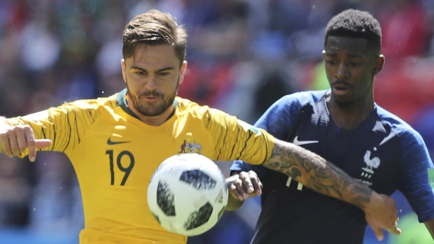 Unfazed: Josh Risdon matches up against Ousmane Dembele. The Wanderer is valued at 750,000 euros on the player's transfer market; the Frenchman, 80 million.