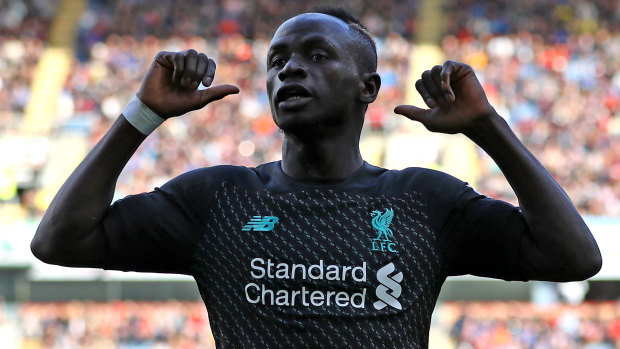 Mixed message: Sadio Mane celebrates a Liverpool goal against Burnley FC, but was later furious at being replaced.