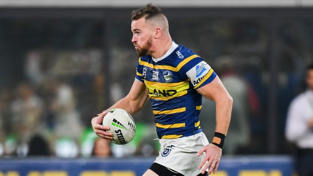 Streaking away: Clint Gutherson, on his way to an 80m try on Sunday, is still to agree terms with the Eels.