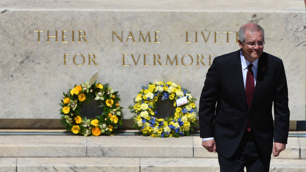 Prime Minister Scott Morrison lays a wreath during Remembrance Day at the Australian War Memorial.