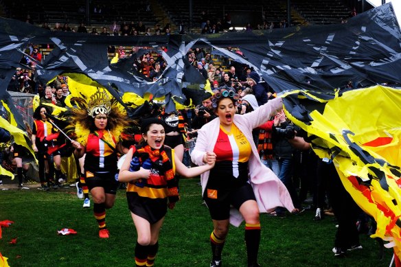 The Rockdogs enter the oval for the Community Cup in 2019.