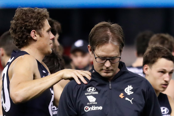 David Teague is consoled by Charlie Curnow during the Blues’ clash with GWS on Saturday night.