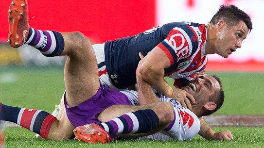 Strained relationship: Former teammates Cooper Cronk and Cameron Smith collide in the 2018 grand final.