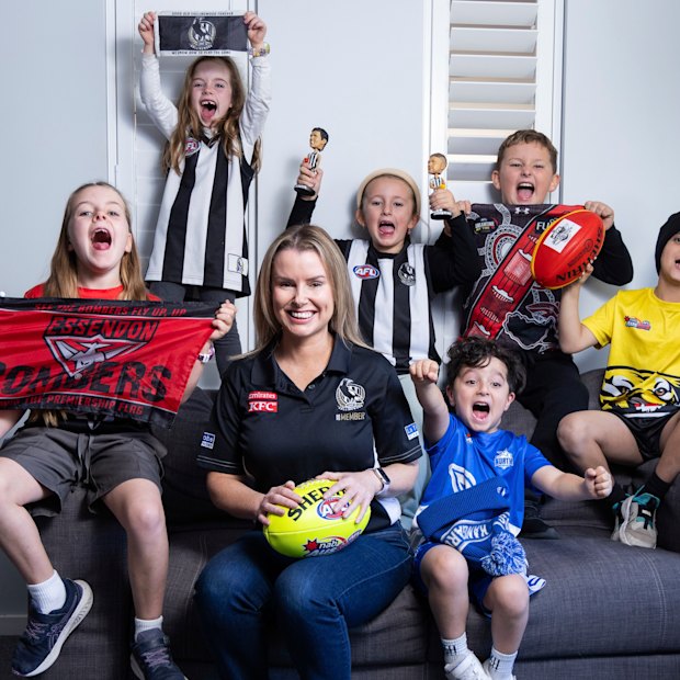 Casey Nunn shares the couch with young footy fans (from left) Charlotte, Chloe, Molly, Andre, Lachlan and Levi.