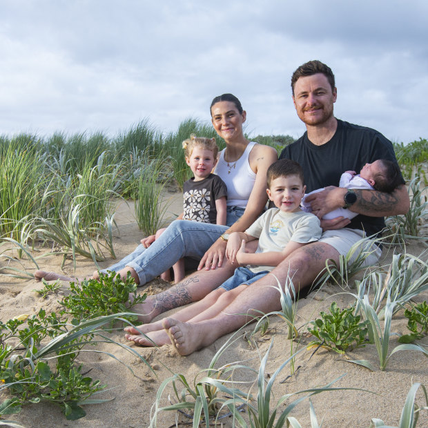 Matt Sinden and Whitney Tucker with their children Atlas, Kenzie and baby Scottie.
