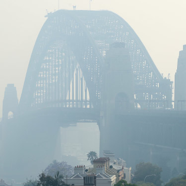 Sydney Harbour Bridge, shrouded by bushfire smoke last November. 