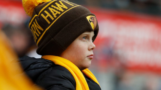 A young Hawthorn fan watches a match in Hobart last year.