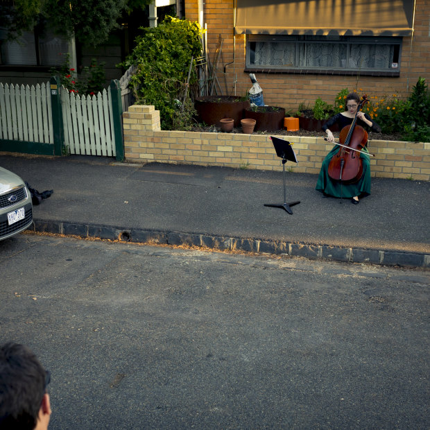 Taking it to the streets … chamber musician Josephine Vains plays a social distancing “concert” for her neighbourhood in Melbourne’s Brunswick.
