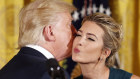 Ivanka Trump air-kisses her father, Donald Trump, in the White House in  2017.