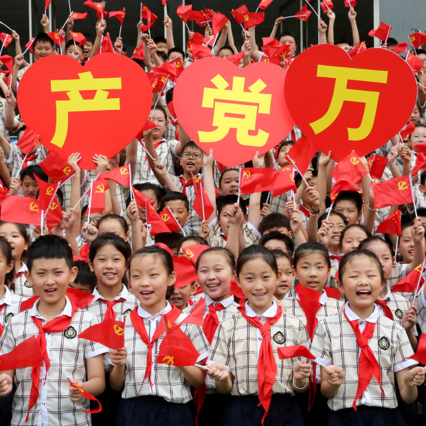 Students celebrate the 100th anniversary of the Party in Shandong Province, China in June. 